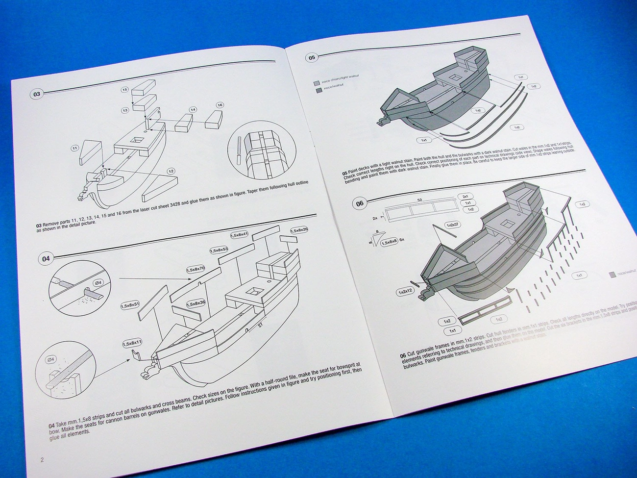 Open instruction manual showing detailed assembly steps for a 1:100 scale Santa Maria model ship kit.